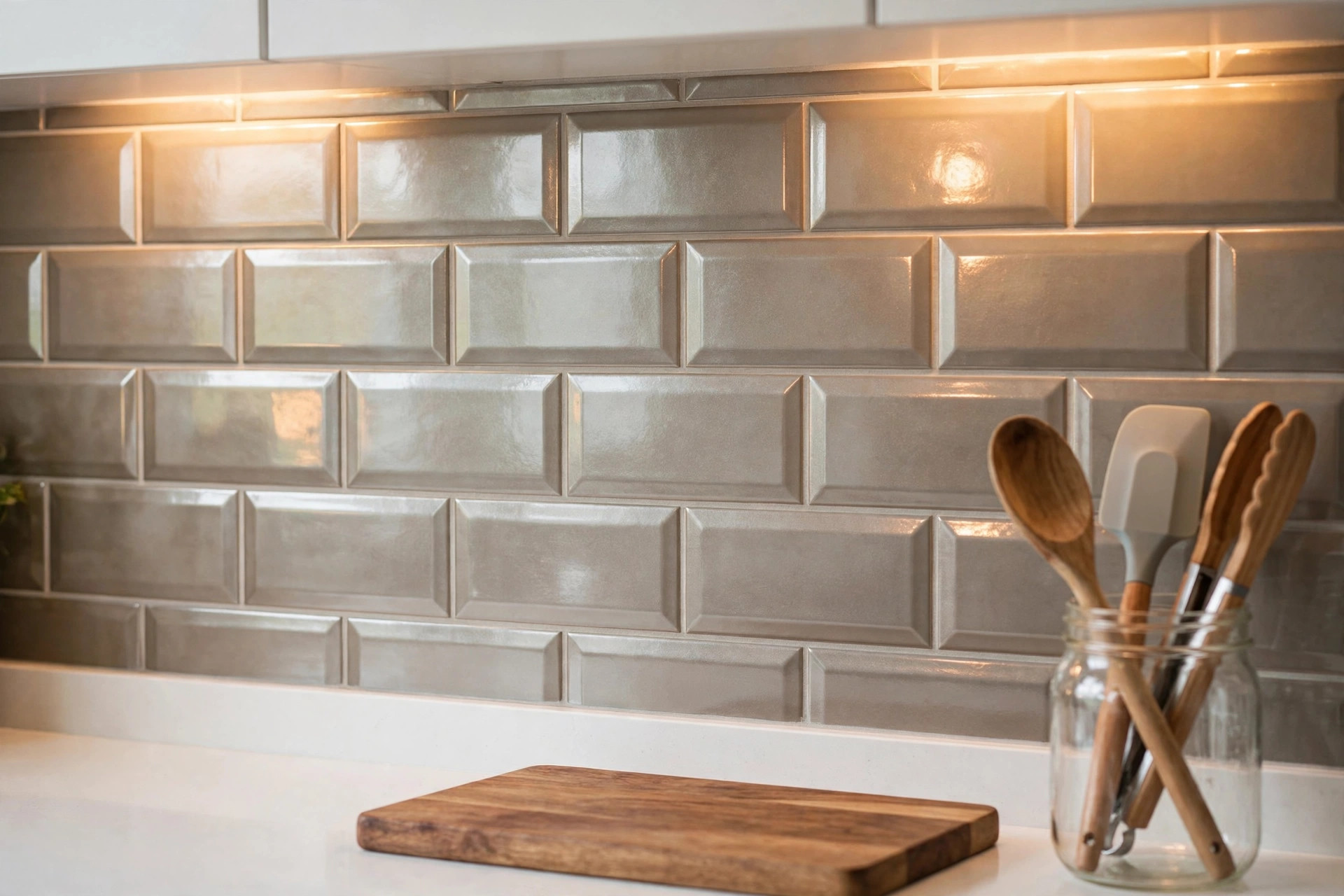 Glossy white subway tile peel-and-stick backsplash in a small kitchen